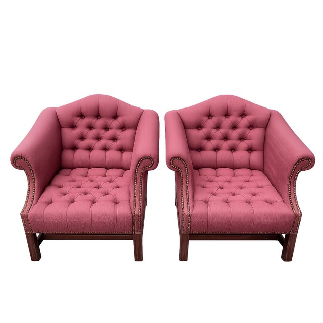 A handsome pair of vintage lounge chairs by St. Timothy Chair Co. of Hickory, North Carolina, showcasing timeless English...