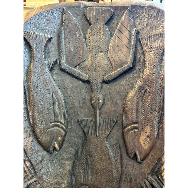 Wonderful hand carved ebony Makonde Palaver African birthing chair with delightful sea creatures. Two parts. Details...