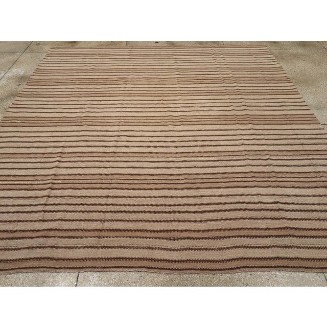 A vintage Turkish flatweave Kilim square room size carpet handmade during the mid-20th century. Measures: 10' 2" x 10' 7"