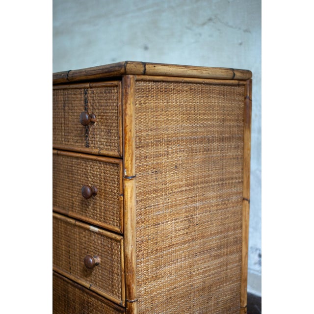 Small Bamboo and Rush Fabric Chest of Drawers – 1970s Crafted in bamboo and clad in wicker fabric. Four drawers.