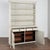This pine cupboard may be used as a display cabinet or bookcase. Dentil molding, diamonds on the drawers and fluted...