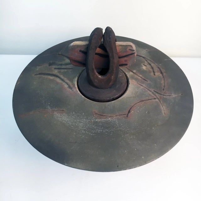 This sculptural piece is reminiscent of a samurai's helmet and breaks down into 4 separate components. Dimensions: 15.5" x...