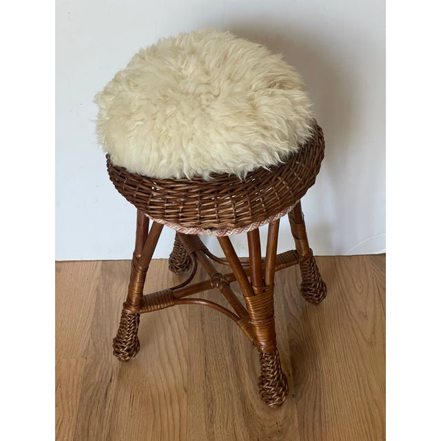 1950 th handmade wicker stool with lamb skin fur pillow.