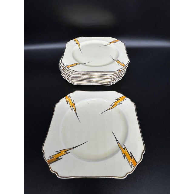 A rare Art Deco porcelain dinnerware set designed by Hugh Longport for Konny Kraft, dating from the 1920s–1930s. This set...
