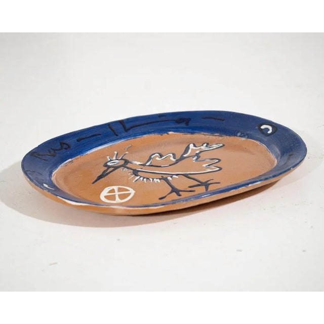 Ceramic dish in picasso style from 20th century. Signed ramus flemming. H. 34 w. 41 d. 4 cm. H. 13.3 w. 16.1 d. 1.5 in.