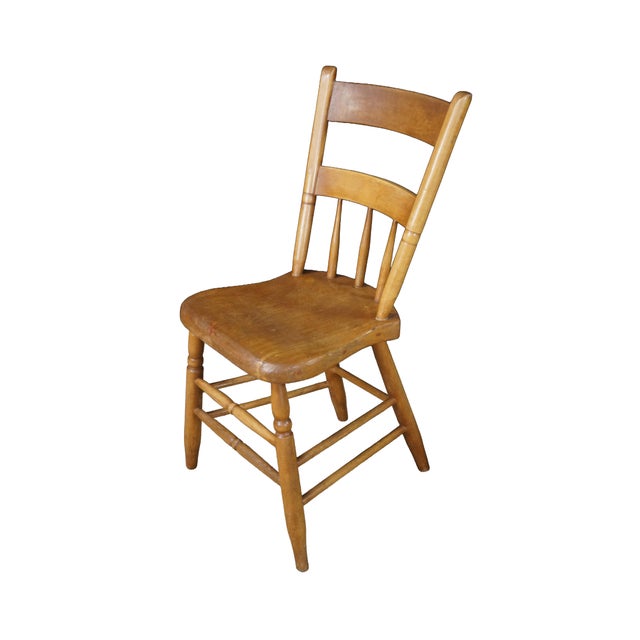 This pair of vintage dining room side chairs features a classic Early American style expertly crafted from solid maple...