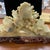 This antique handcarved soapstone sculpture of a grape vine originates from China and exudes an ivory color. Crafted with...