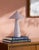 Illuminate your space with a touch of retro flair with the Nomelle accent table lamp. Standing at a charming 12 inches...