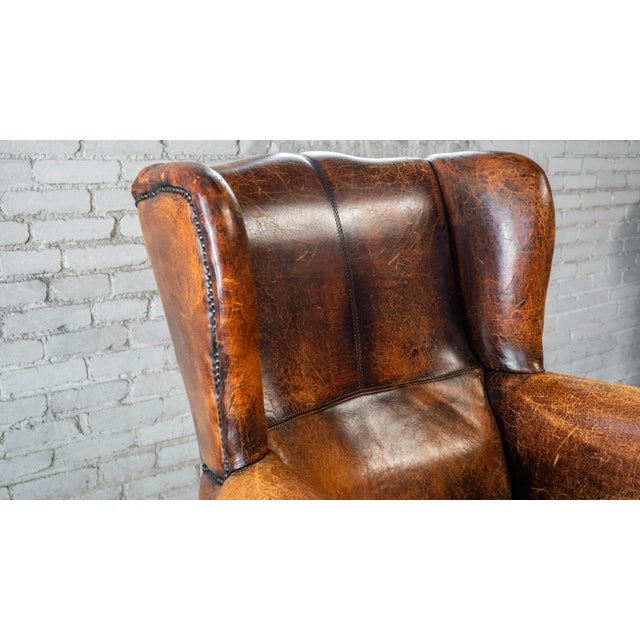 1970s Vintage Art Deco Distressed Cognac Leather Wingback Chair & Ottoman For Sale - Image 10 of 16