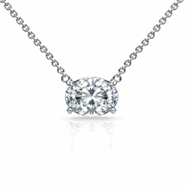 1-3 carat floating oval diamond pendant necklace set east-west on a delicate 14K gold cable chain. Diamond available in 1,...