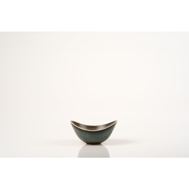 Iconic stoneware bowl by Gunnar Nylund for Rörstrand. Modern and timeless design. This piece is coated with a multi-...
