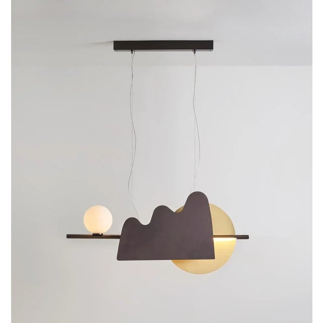 Nacho pendant by sylvain willenz dimensions: d 12 x w 130 x h 45 cm materials: solid brass, polycarbonate, opal glass the...