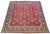 This 1960s Persian rug hand-knotted in wool has a red field with multicolor accents in an all-over floral pattern. This...