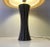 Stylish 1970s ceramic table light decorated with white stripes on a black main color. Anonymous Scandinavian maker circa...