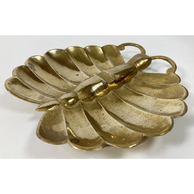 Unique mid century modern brass butterfly shaped catchall dish. This whimsical design is ideal as catchall, ashtray, or...