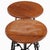 An exceptional pair of artist-made stools, likely from France, handcrafted from forged iron and solid oak. The sculptural...