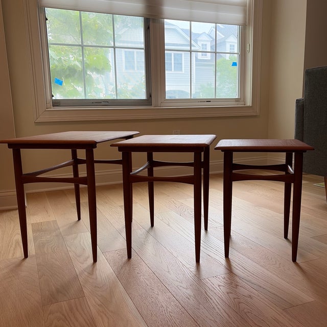 A beautifully crafted 1960s Danish teak nesting table set consisting of three graduated tables that nest neatly together...