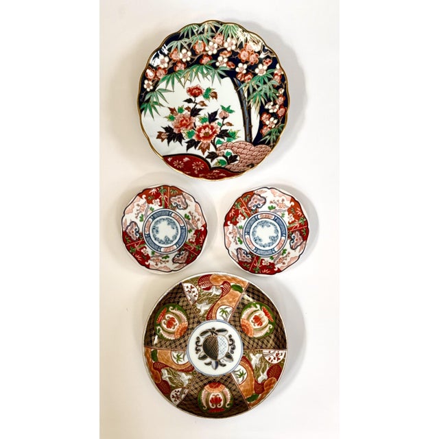 Four (4) Imari plates that can be hung in a variety of arrangements. Two examples of how these plates may be arranged are...