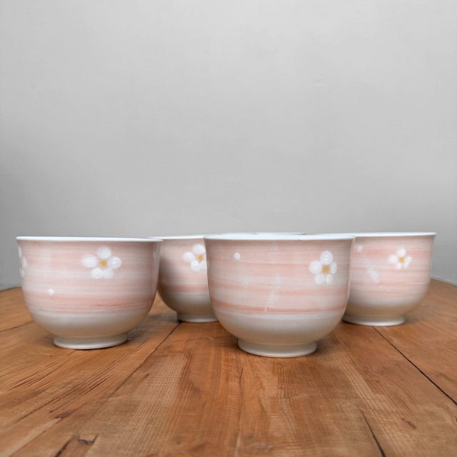 Atmospheric set of five Japanese tea bowls (yunomi) from Arita, the porcelain town in Saga that has been renowned for its...