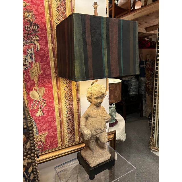 Divine and one of kind pair of impressive table lamps created from antique cement garden statuary of romantic cherubs....