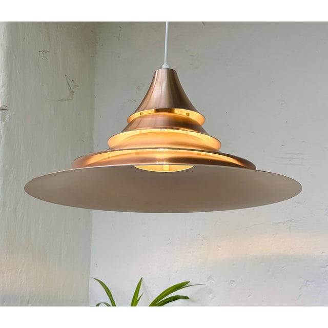 A striking vintage pendant lamp, model Pagoda, designed by Ricardoni and produced by Nordisk Solar Compagni in the early...
