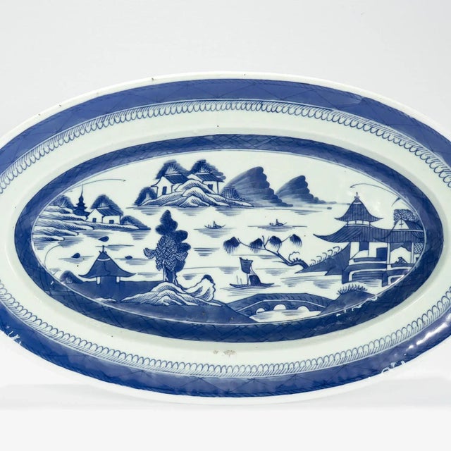 A large fine antique Chinese export porcelain serving tray. In the Canton pattern. Decorated in underglaze blue. Depicting...