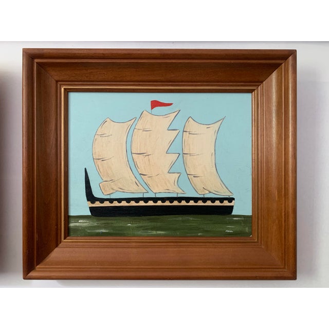 This coordinating set of seascapes pairs robin's egg blue skies with avocado green foregrounds and black vessels, softened...