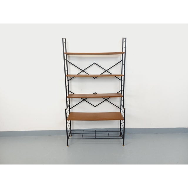 Vintage Scandinavian-style bookcase from the 1960s, Italian design, in teak, brass, and black metal, with 5 open shelves....