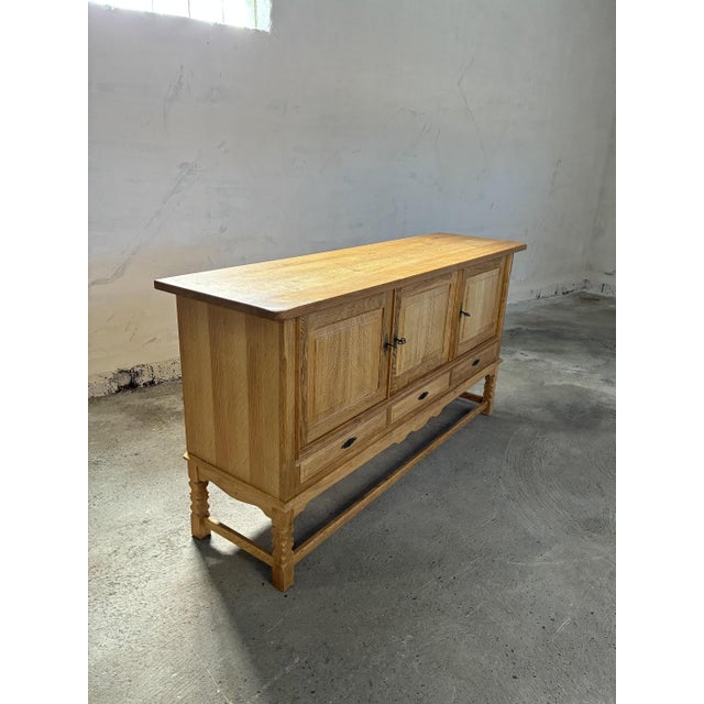 Oak Sideboard in style of Henning Kjærnulf, 1970s, in Very Good conditions. Designed 1970 to 1979 This piece is attributed...