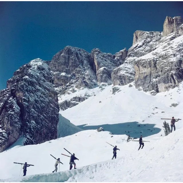 Cortina D’Ampezzo (1962) Limited Estate Stamped (Photo by Slim Aarons) Skiers walk up a mountain in Cortina D’Ampezzo, a...
