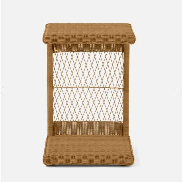 Elevate your indoor or outdoor living area with this charming wicker style laptop table. Made with faux wicker and a sleek...