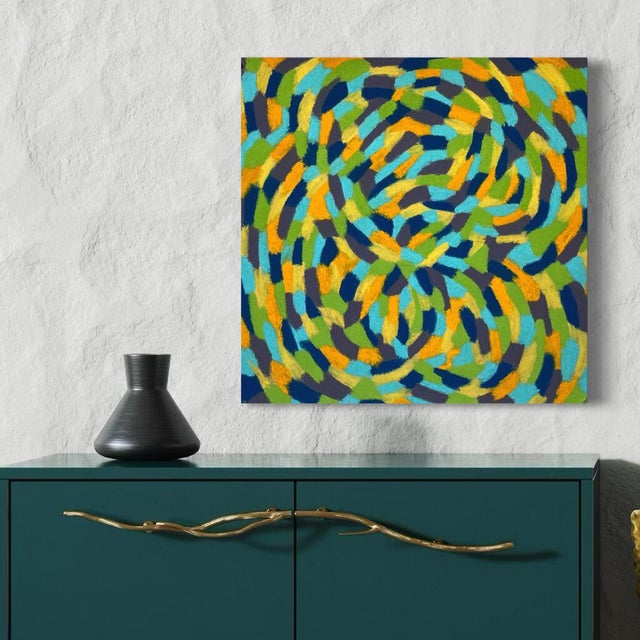 Overlapping loops of turquoise, marigold, olive green and navy swirl across the sheet in broad, blocky strokes, curling...
