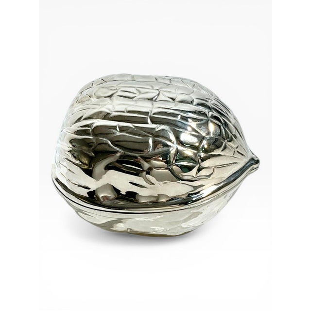 dd a touch of whimsical elegance to your décor with this vintage French silver-plated walnut form covered box. Sourced in...