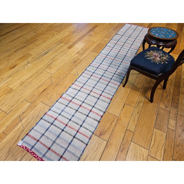 Vintage American Rag Runner, a beautifully handwoven textile that blends traditional craftsmanship with a clean, modern...
