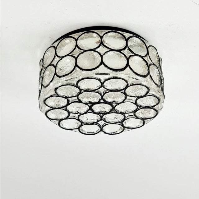 Stunning pair of mid-century modern glass ceiling mount fixtures from Limburg, Germany's leading glasswork, renowned for...