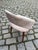 A finely crafted upholstered chair with a curved backrest, elegantly combining comfort and Danish craftsmanship. The...