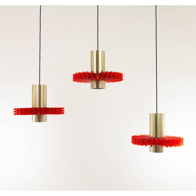 Set of three aluminium and acrylic pendants, nicknamed 'Priest collar', designed by Claus Bolby for Danish lighting...