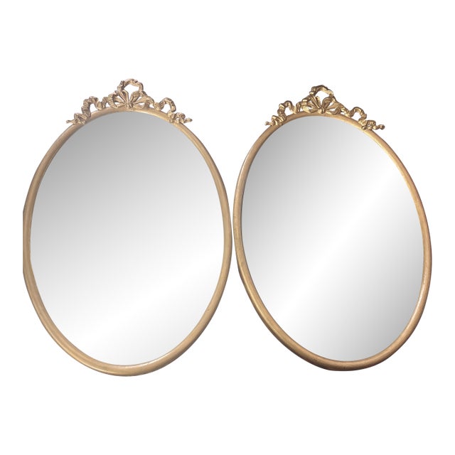 Early 20th Century Oval Large Cast Brass Frames With Heavy Metal Ribbon Trim at Top- A Pair For Sale