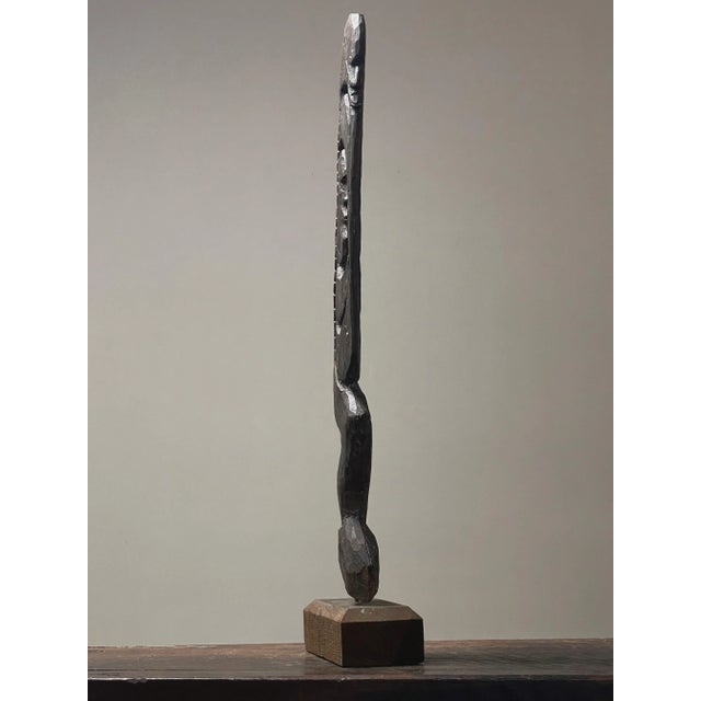 Papua New Guinea. Early 1900s. Hand carved figure on wood base. In used condition with wear consistent with age. Please...
