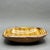 • Handmade studio art pottery dish with rounded rectangular form and irregular rim. • Mid-century design, likely...