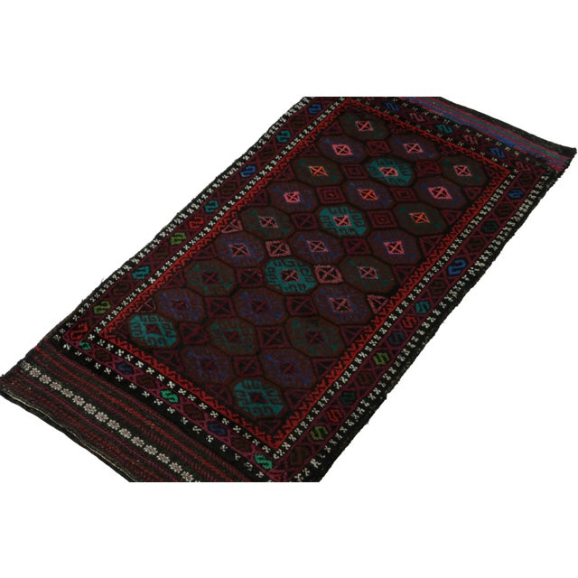 Hand knotted in wool, this 2x4 Baluch rug represents a new line of tribal carpets in the Modern Classics Collection by Rug...