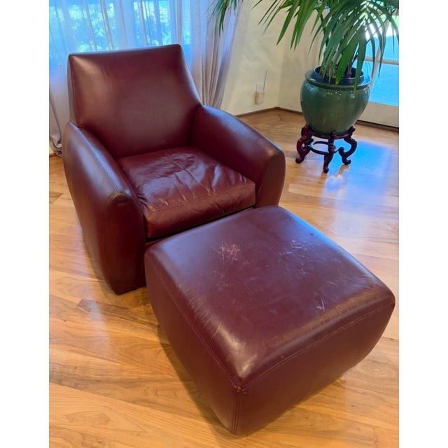The premium leather-covered Ke-Zu 35”Hx33”Wx36”D chair & 18”Hx24”Wx24”D ottoman is a iconic 1988 furniture design by...