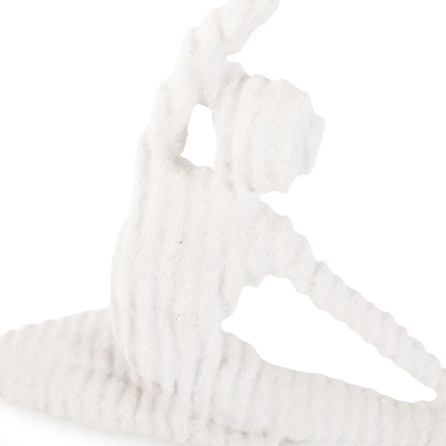 In textured white with ribbed detailing, these sculptures unique shape blend a touch of tranquility to any space....