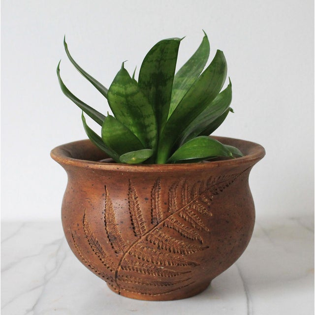 Vintage pottery planter with double sided incised fern leaf. No makers mark. Minor age wear.