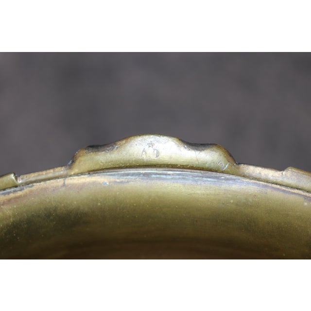 This extraordinary late 19th-century French patinated and gilt bronze centerpiece in the Napoleonic style, by Auguste...