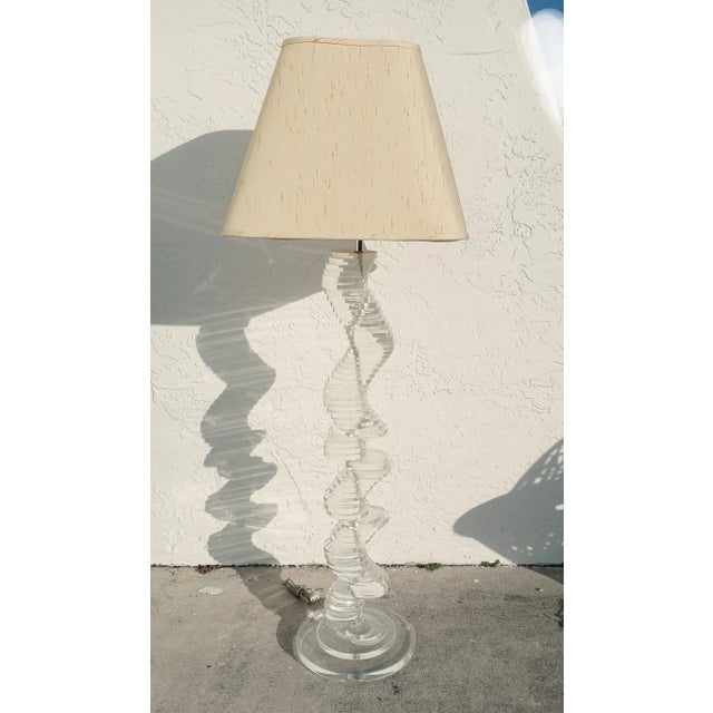 A beautiful vintage Mid Century Modern lucite stacked disc floor lamp in the style of Charles Hollis Jones. The lamp...