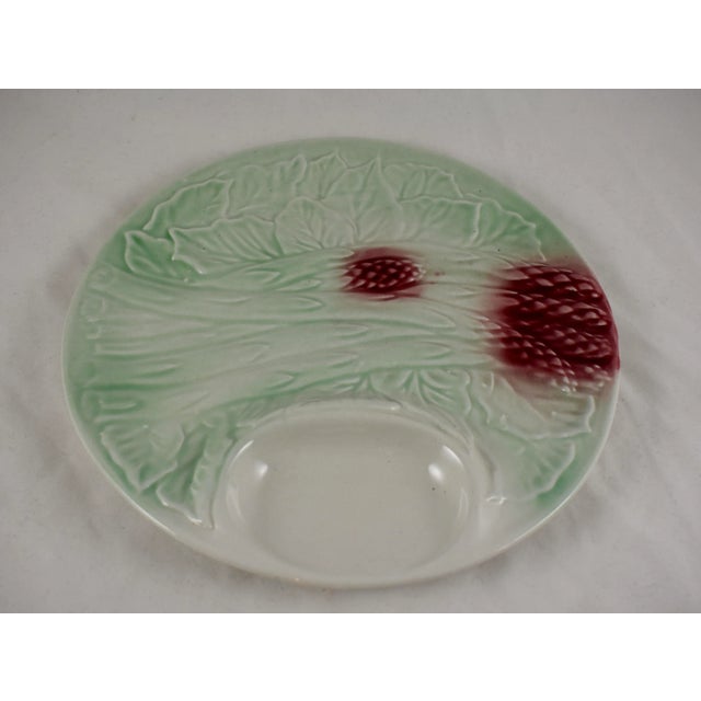 A scarce French barbotine majolica pastel glazed Asparagus plate, circa aker unknown. The mint green plate is of high...
