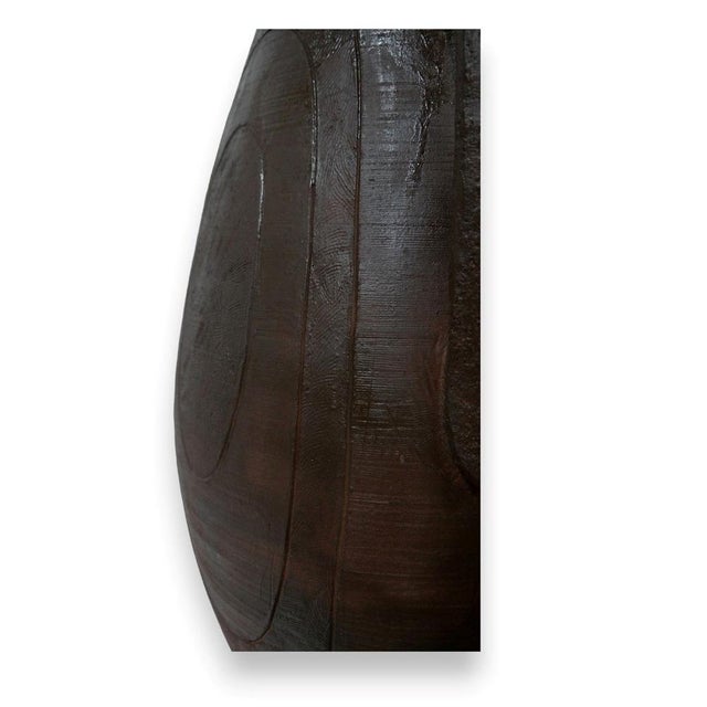 A gigantic ceramic floor vase with a textured surface. Thanks to its timeless design, it is perfectly suited to both...