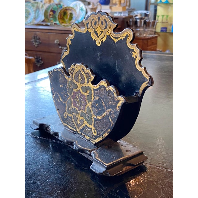 Antique black paper maché letter holder with green, red and gilt.