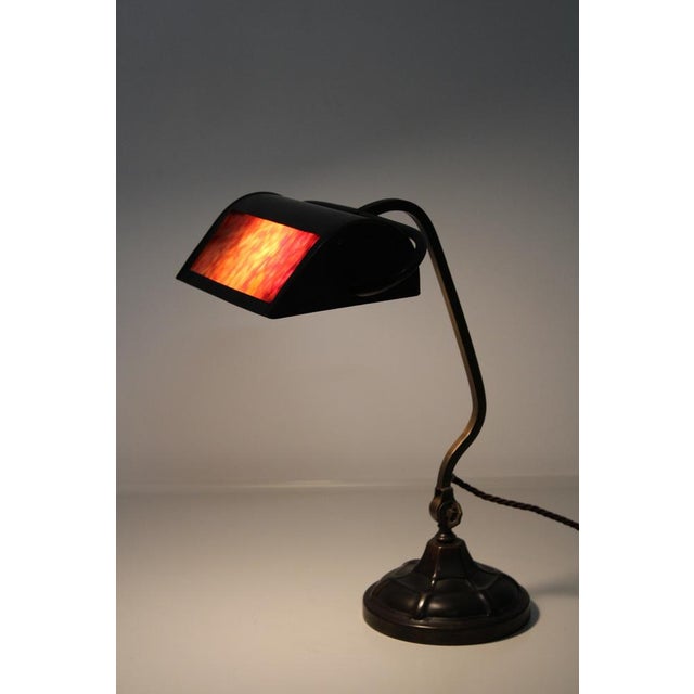 Glass insert made of color glass (Loetz?), Material Patinated brass. European Plug (up to 250V).The wiring of this item...